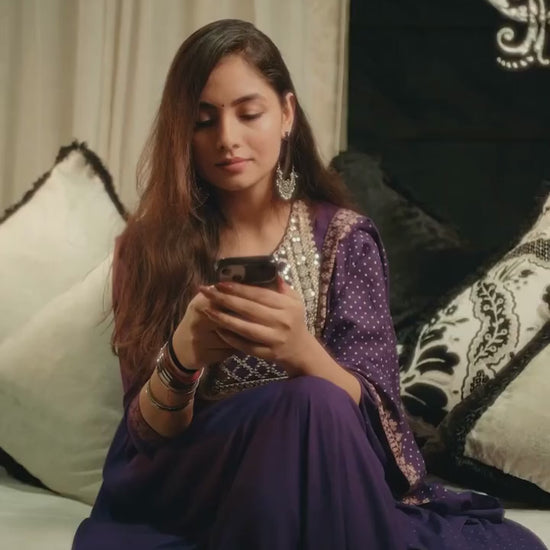Raksha Bandhan celebration video featuring a brother and sister performing rakhi tying ceremony, with a black "Brother" temperature bottle and two designer rakhi bracelets as gifts