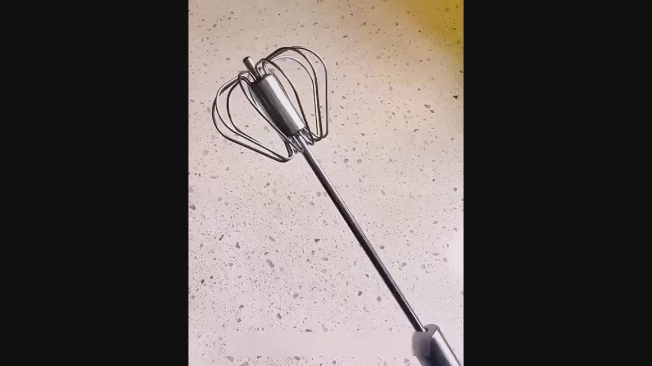 Product demonstration video of a steel hand press blender with a manual rotary whisk, showing its use for mixing and beating eggs in the kitchen