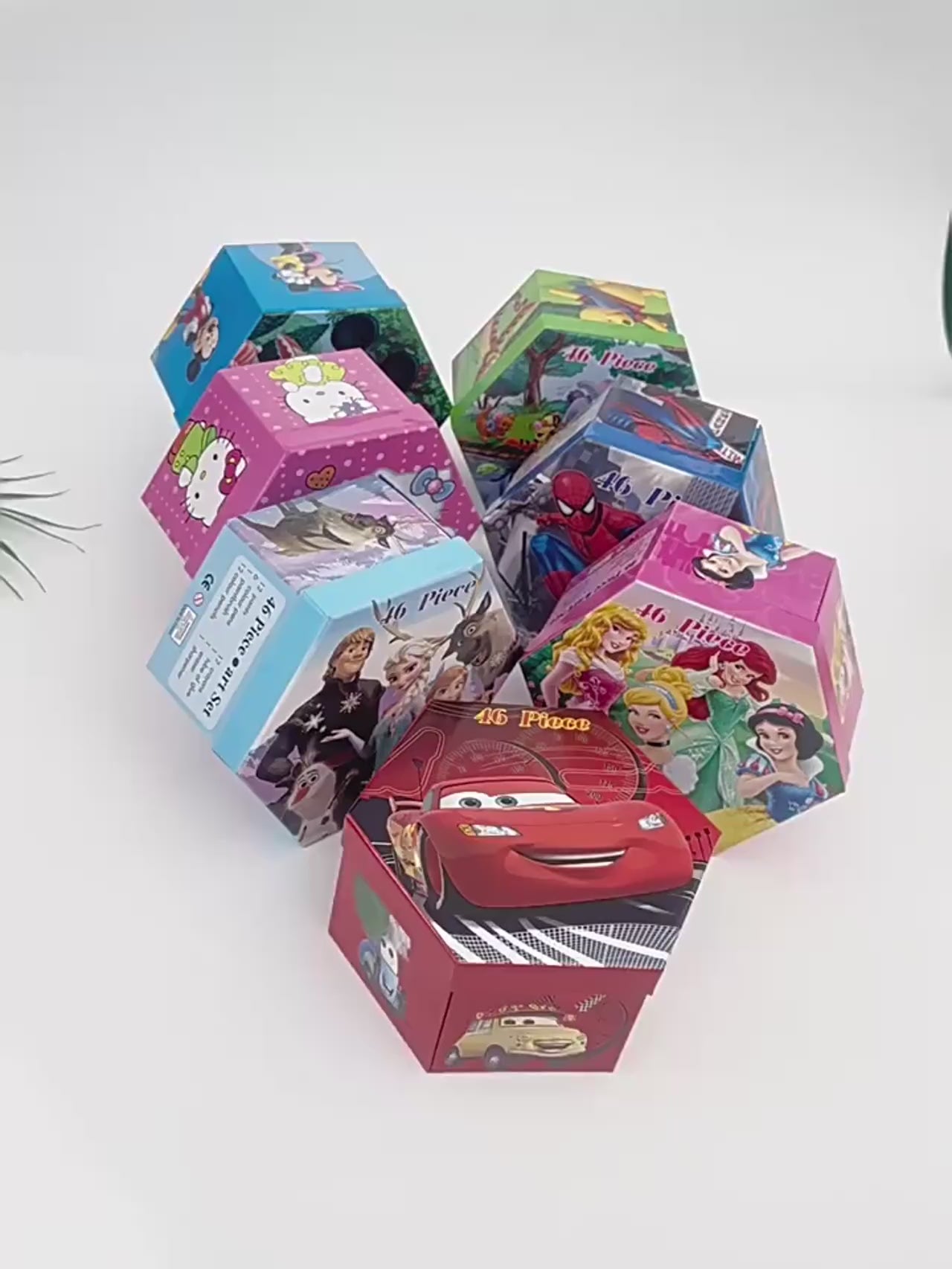 Video displaying a variety of kids’ art sets in colorful hexagonal boxes with popular cartoon designs, perfect for creative drawing and painting activities