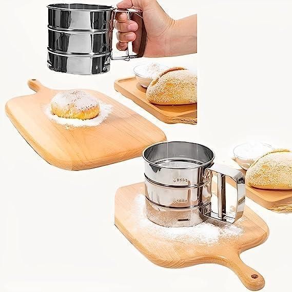 Stainless steel handheld flour sifter with manual press handle, perfect for sifting flour, sugar, and cocoa powder onto bread and pastries, ideal for baking